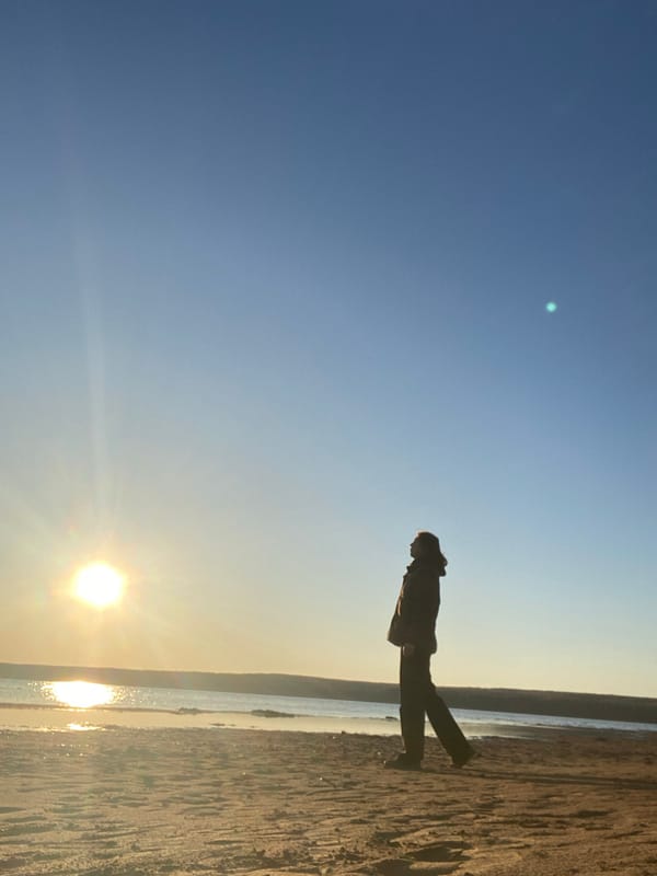 Woman documents sunset beach visit in Chaikovsky, Russia