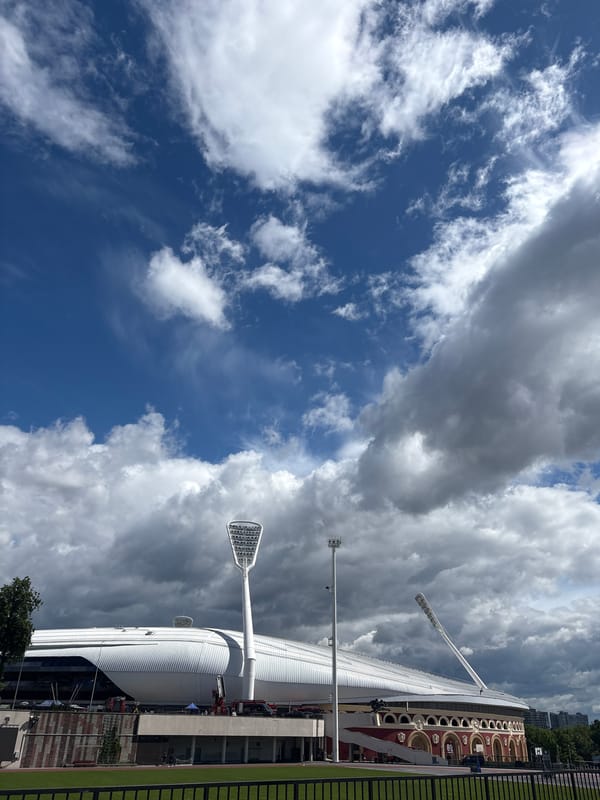 Morning scenes documented across Minsk including stadium, decorated car