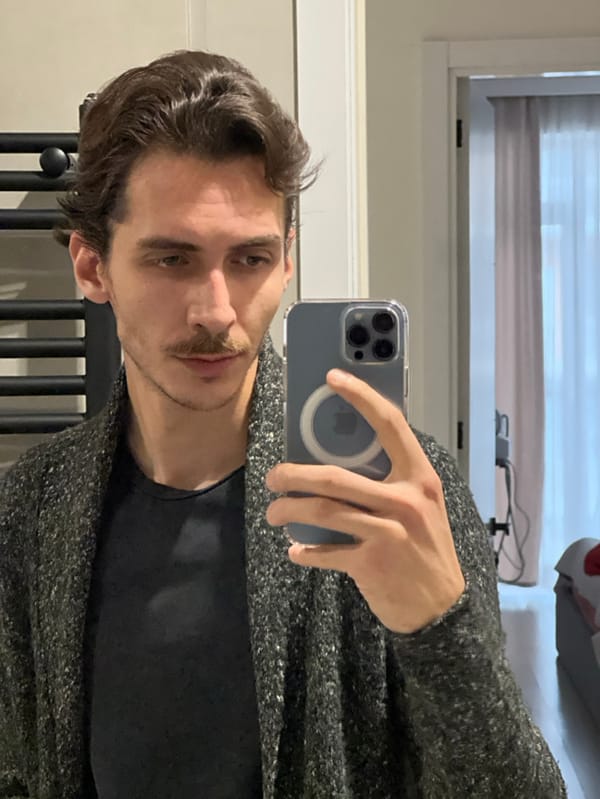 Young Man Takes Multiple Mirror Selfies in Tbilisi Home