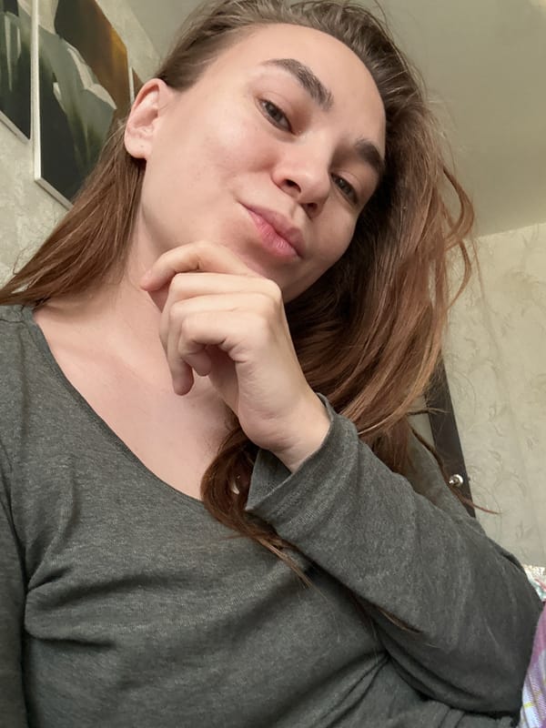 Woman resting in gray shirt observed in Uva, Russia