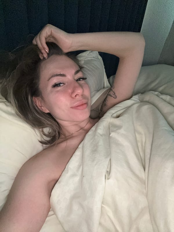 Woman resting in bed captured in early morning Khimki moment