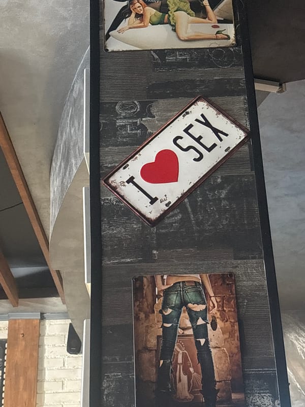 Metal decorative signs displayed on shelf in Bulgarian town