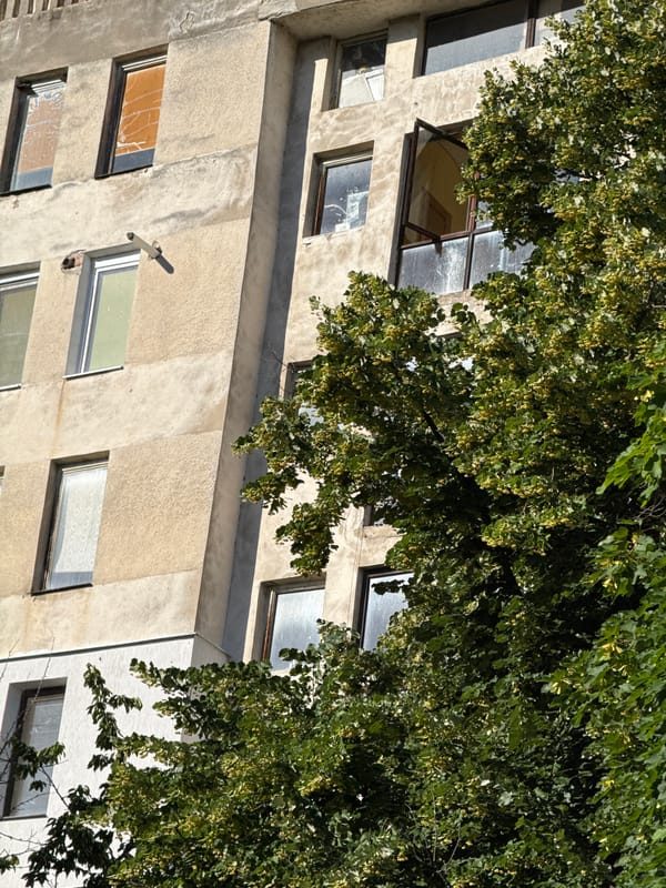 Weathered concrete building facade in Lovech, Bulgaria