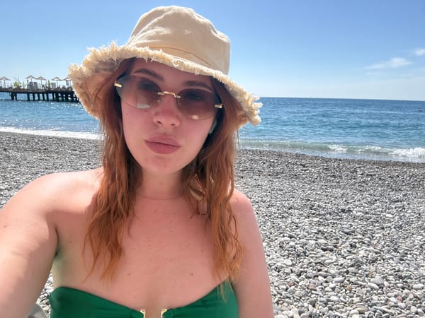 Woman documents beach vacation selfies in Kemer, Turkey