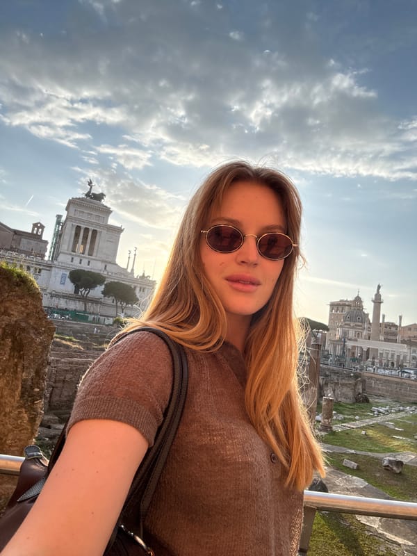 Tourists photograph themselves at Rome's Vittoriano monument Friday afternoon
