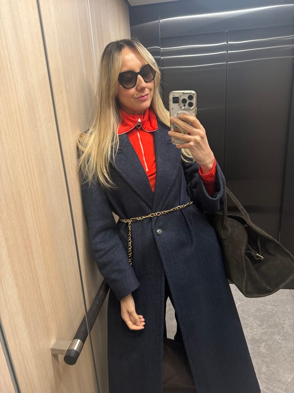 Woman takes mirror selfie in Riga indoor setting