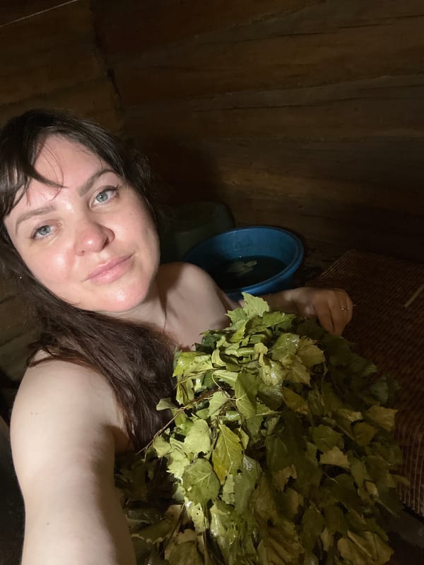 Woman enjoys traditional Russian banya treatment in Panteleevka sauna