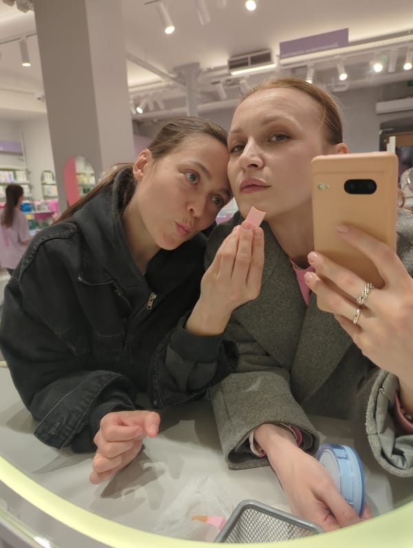 Two women take mirror selfie in Moscow