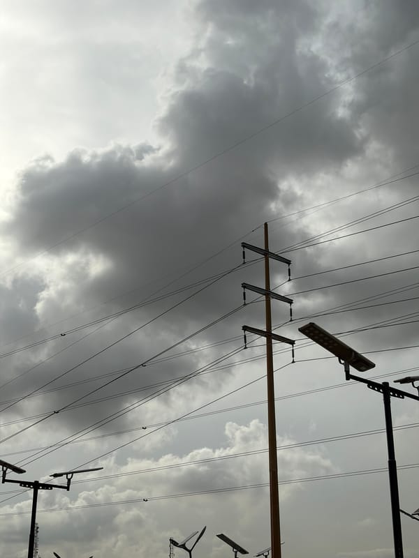 Power lines documented under overcast skies in Igboefon, Nigeria