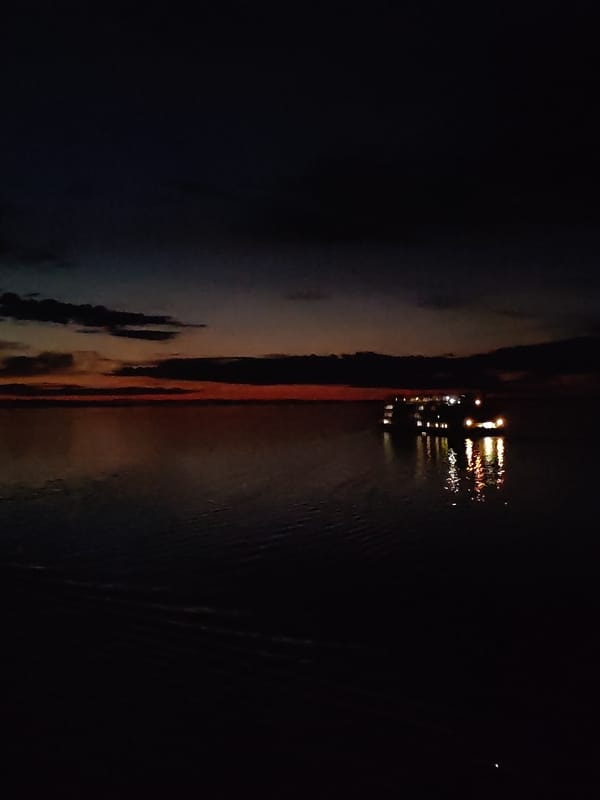 Tourist boat spotted at night over submerged Russian town