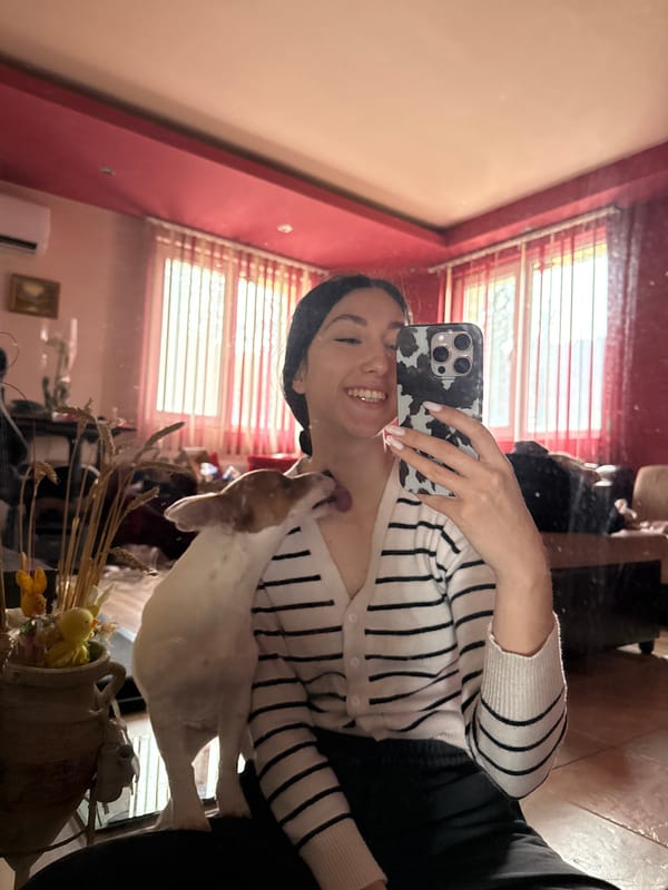 Woman takes mirror selfie with dog in Bulgaria