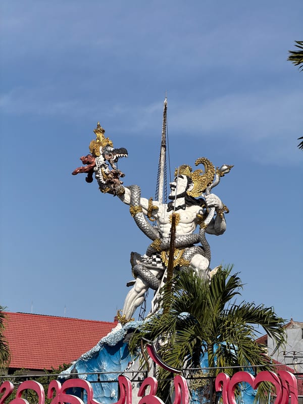 Two angles on Bali's iconic GWK statue at dawn