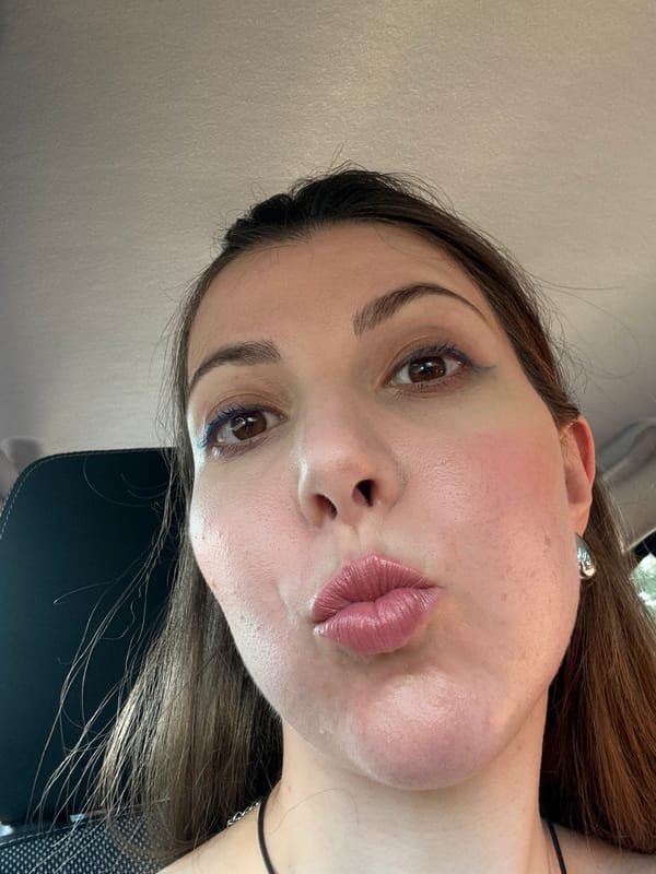 Selfie and scenery from inside a moving vehicle