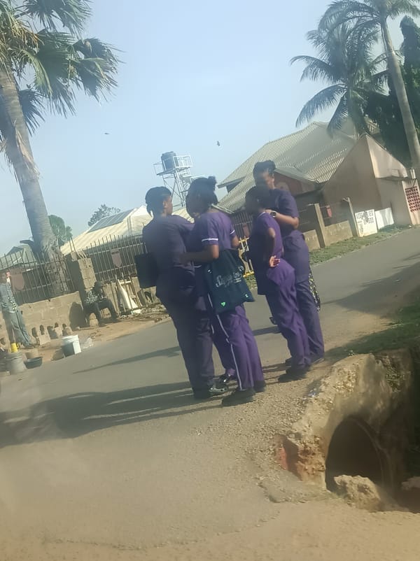Purple-uniformed group and motorcyclist observed in urban street scene