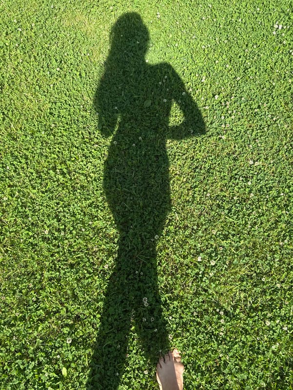Morning in the garden: roses, berries, a dog, and bare feet