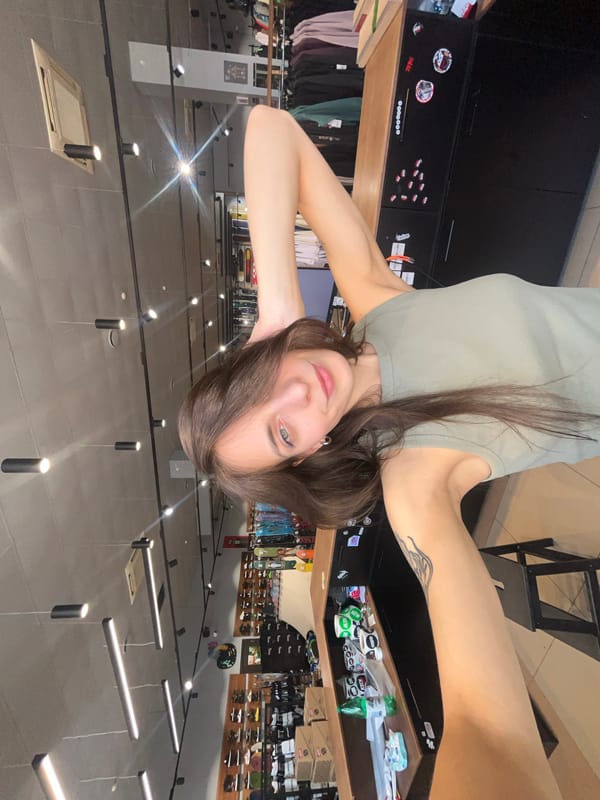 Woman takes playful selfies in Krasnoyarsk clothing store