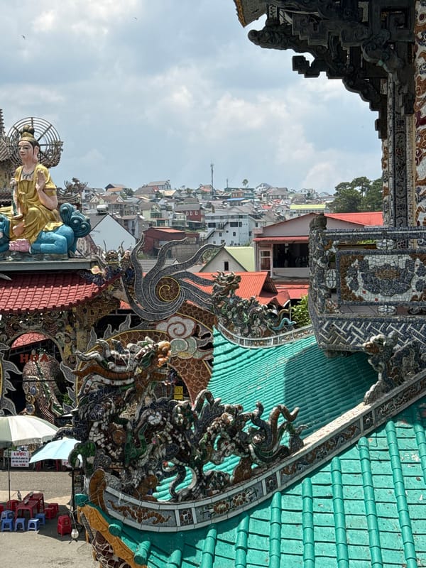 Temple visit documented in Xuân Thành, Vietnam with floral Buddha displays