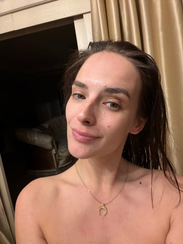 Close-up portrait featuring a crescent moon gold necklace, Ufa