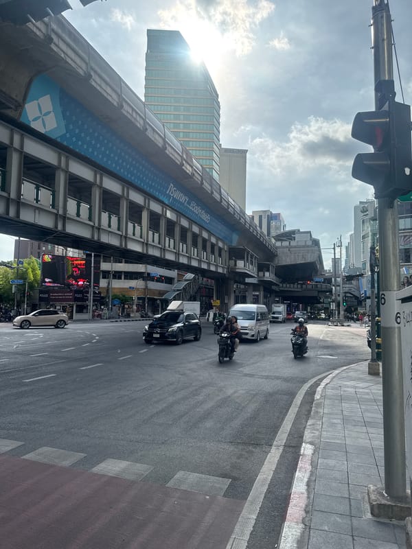 Bangkok street scene captures BTS Skytrain and urban infrastructure