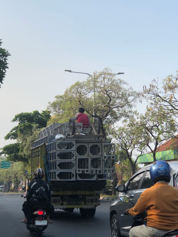 Morning traffic flows through Kludan on a regional Indonesian road