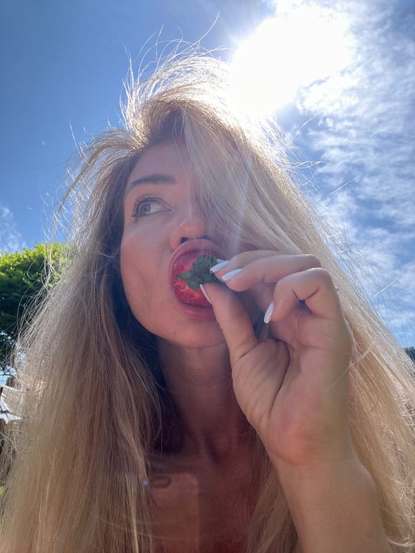 Woman enjoys sunny morning backyard time in Armavir