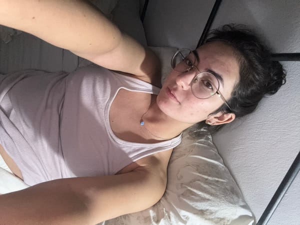 Woman rests in bed during early morning hours in Puebla