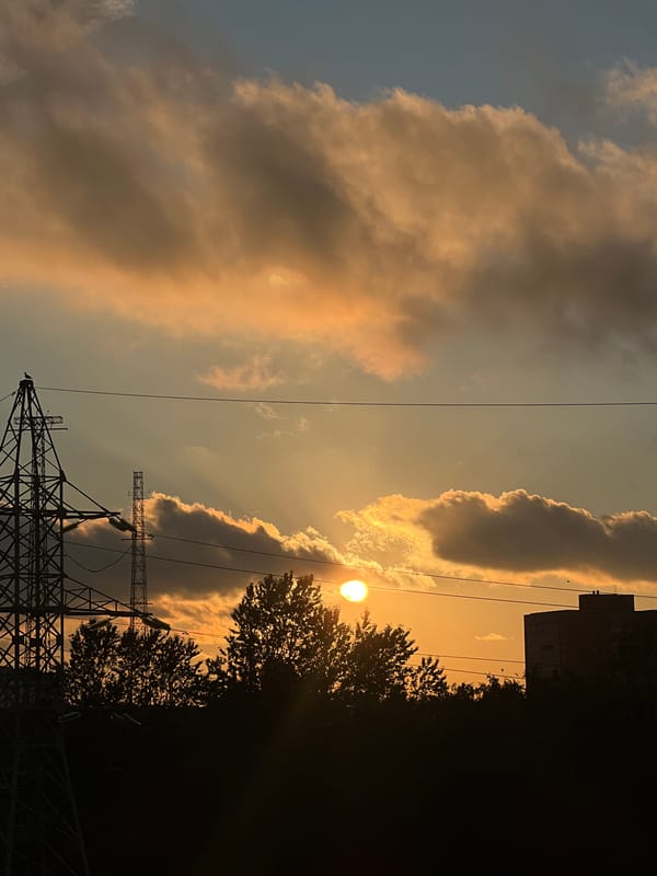 Sunset over Shushary's skyline, pylons and clouds lit up