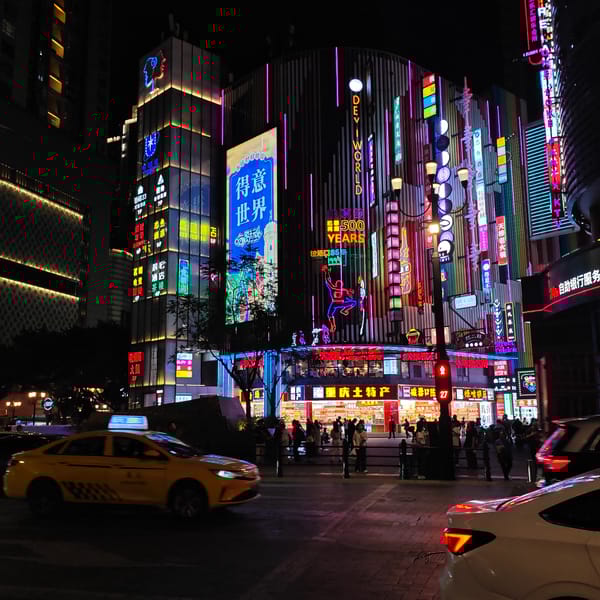 Cultural exhibition and neon-lit streets captured in Yuzhong District