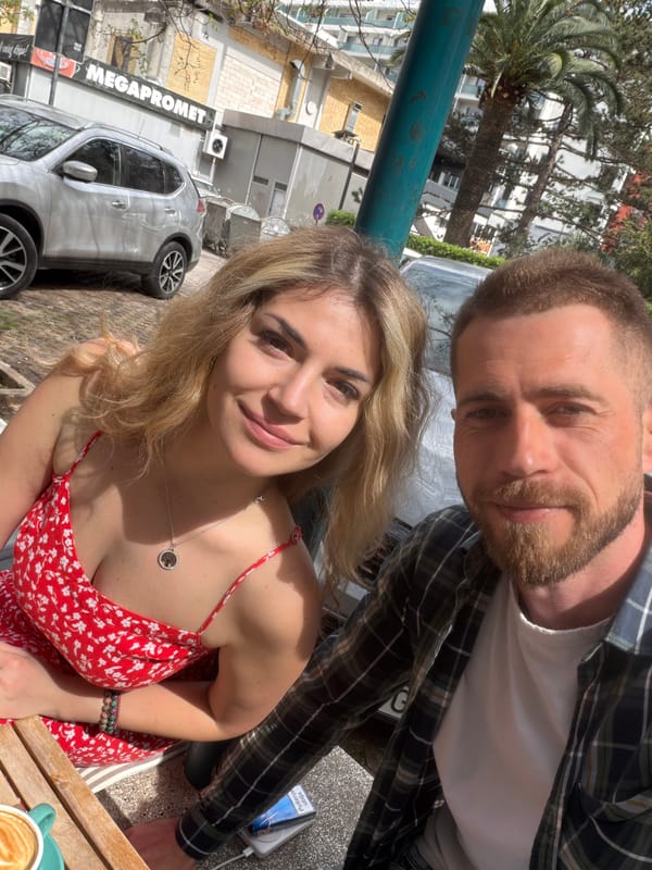 Couple photographed at outdoor cafe in Budva, Montenegro