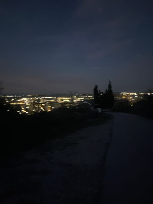 Nighttime cityscape view captured over illuminated Asenovgrad, Bulgaria