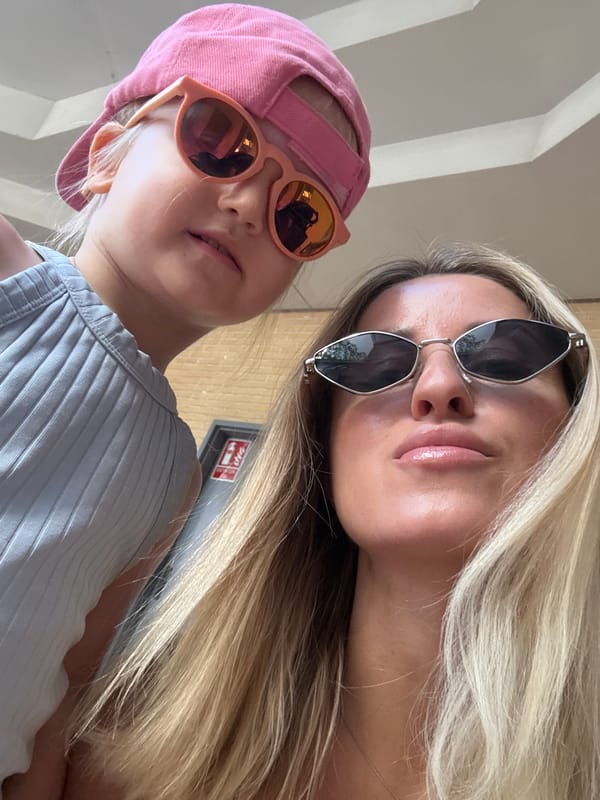 Selfies and shopping in a shaded Valencia walkway