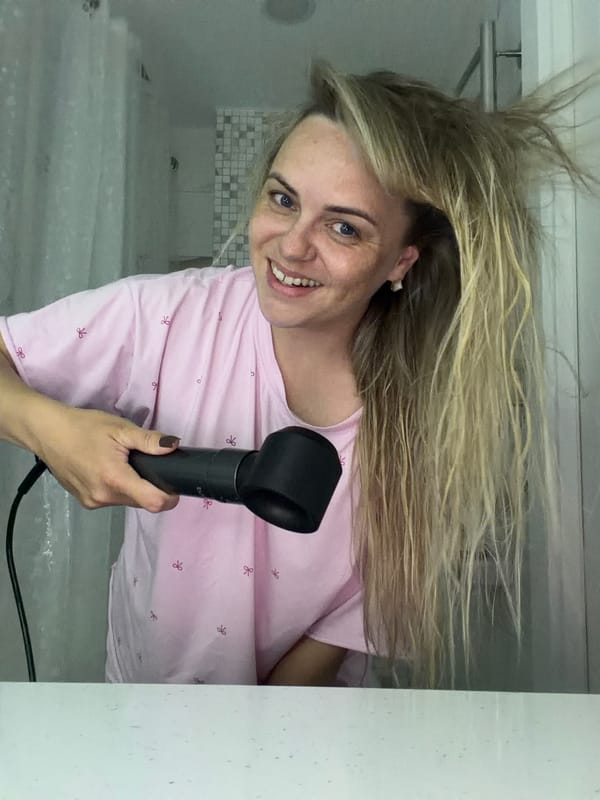 Woman dries hair, takes selfies with dog in Russian bathroom