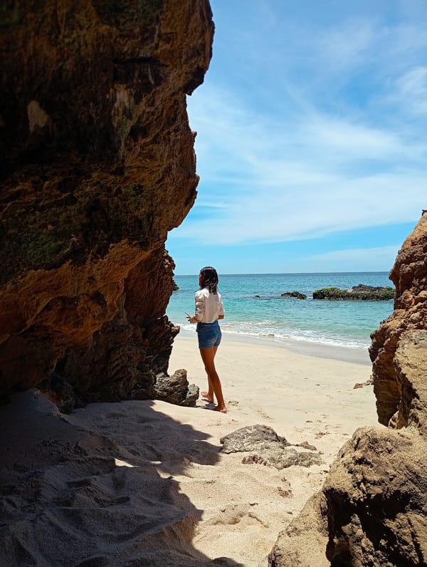 Woman enjoys quiet moment at Venezuelan Caribbean beach