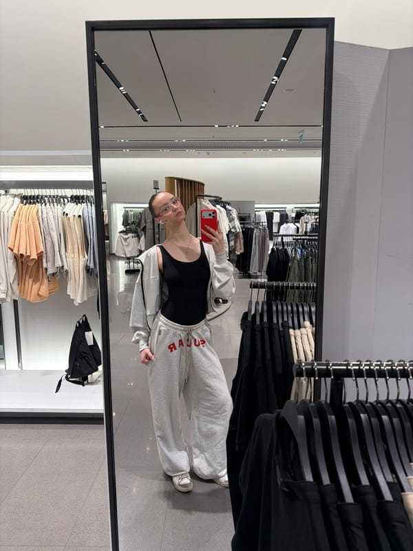 Person Takes Mirror Selfie in Khimki Clothing Store