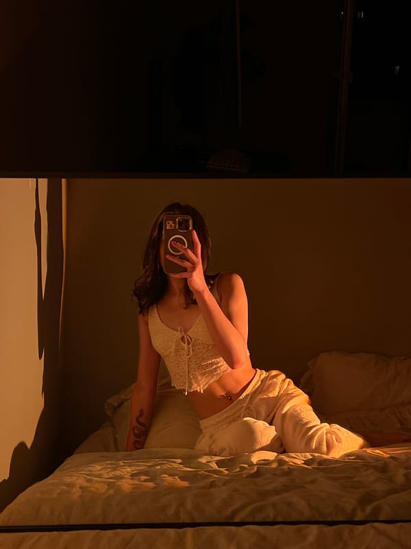 Person takes bedroom selfies in Ternopil during evening hours