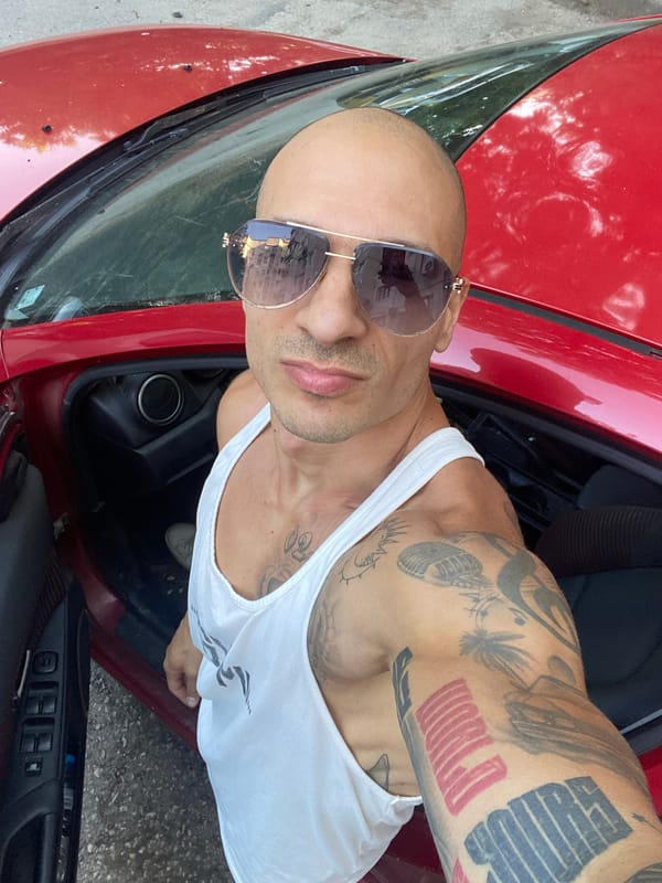 Red car, tattoos, and a wrinkly dog in Pleven
