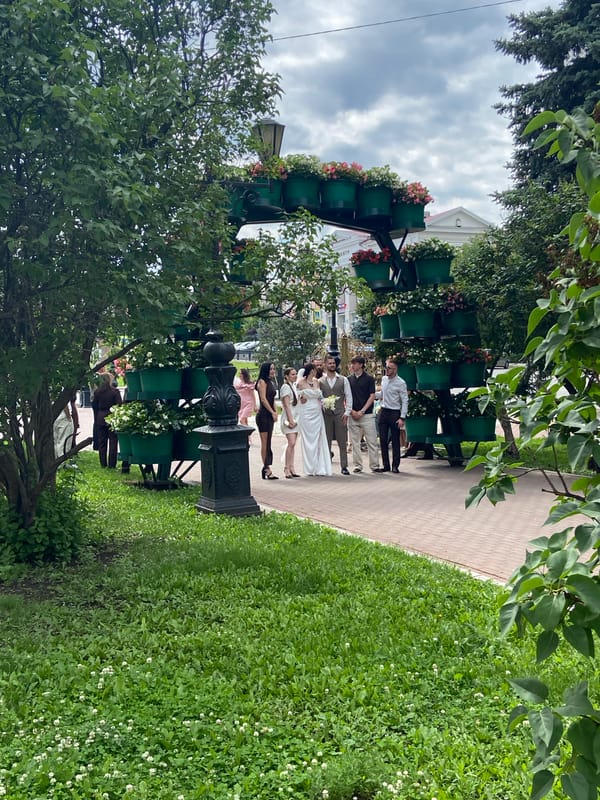 Wedding party and city streets on a June morning in Ufa