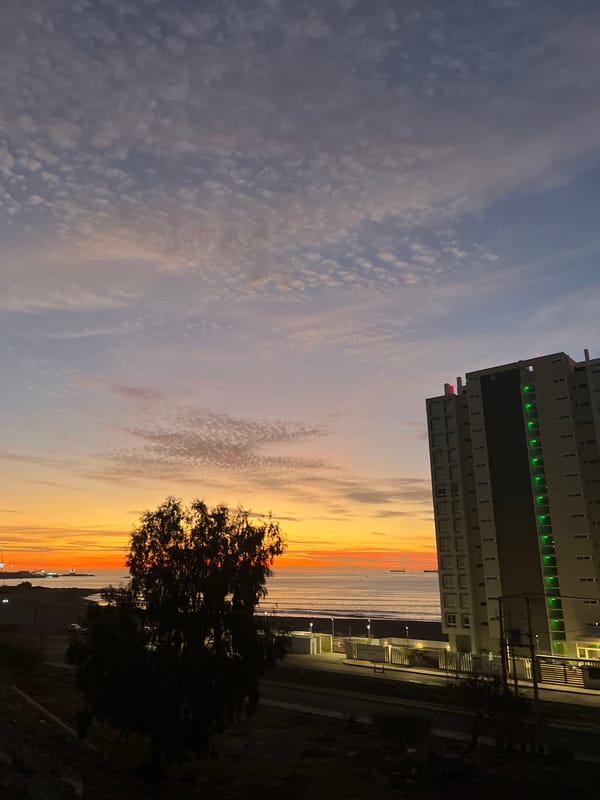 Vibrant sunset documented across Arica, Chile coastal roads