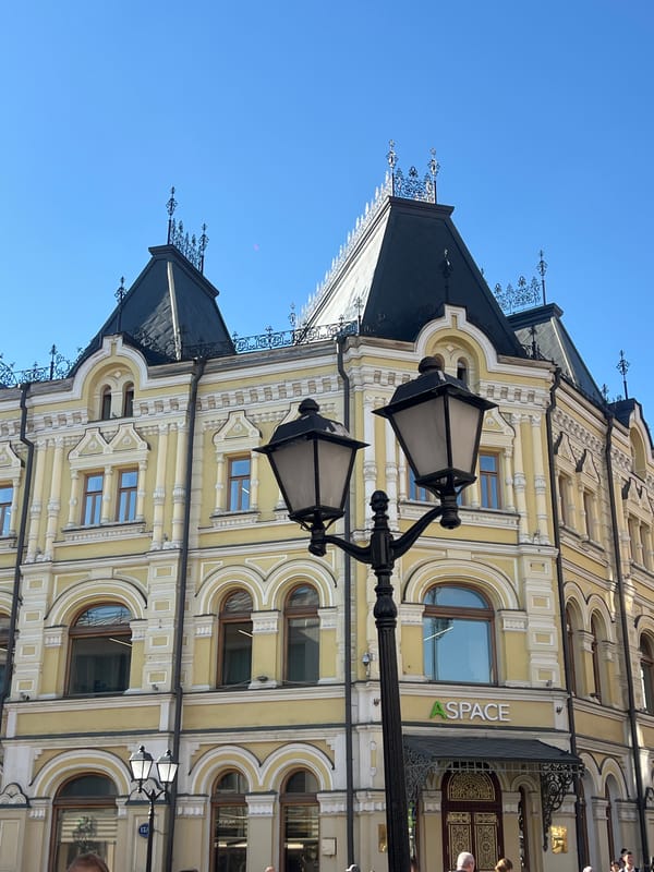 Tourist documents sunny afternoon stroll through historic Moscow streets