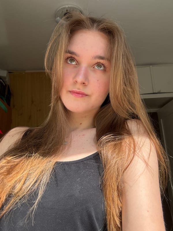 Young woman takes playful selfies in Perm apartment