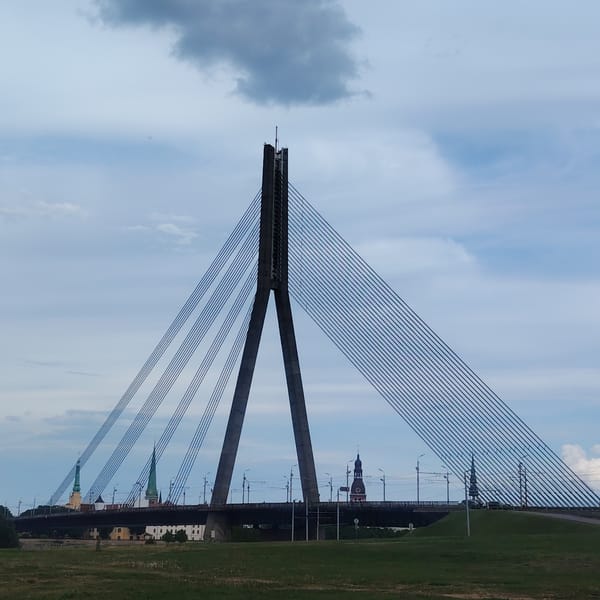 Witness documents Riga waterfront landmarks during overcast afternoon