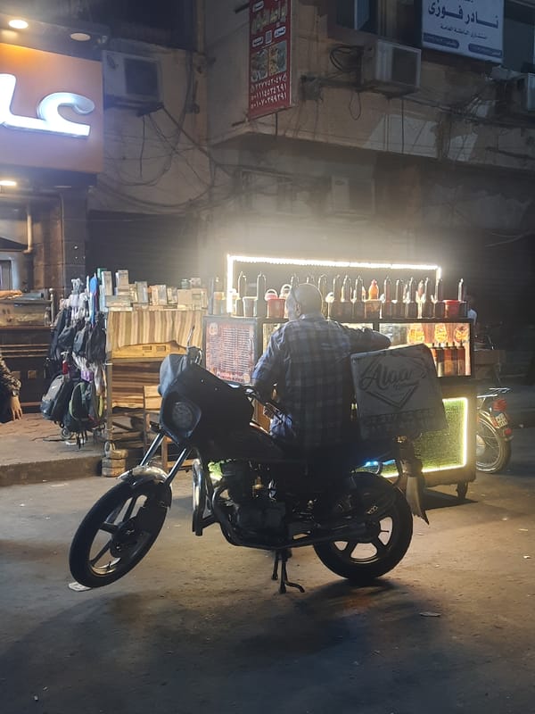 Motorcycle food vendor spotted on Cairo street at night