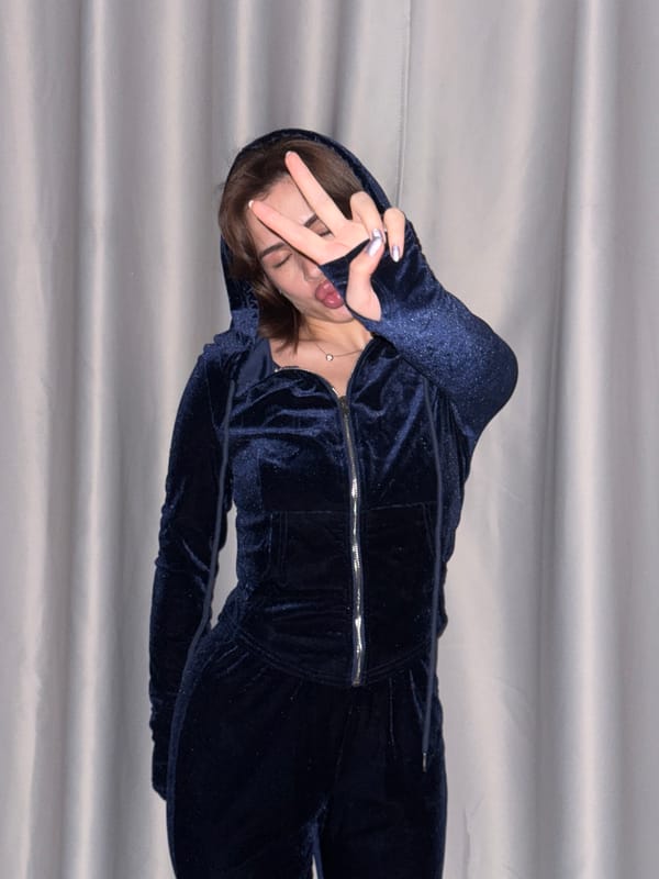 Woman in blue tracksuit poses for photos in Лобаново
