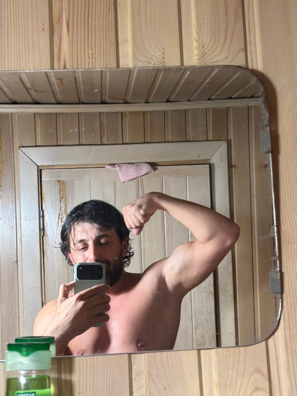 Man Takes Flexing Mirror Selfies in Russian Sauna