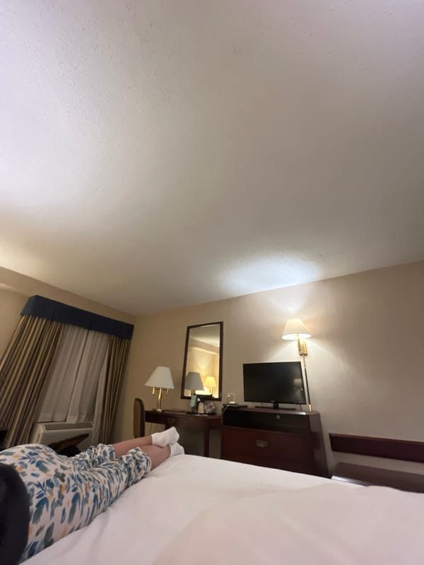 Person rests in bedroom during early morning hours