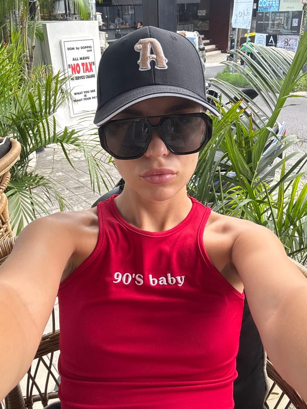 Person in 90s-themed clothing captured in selfie