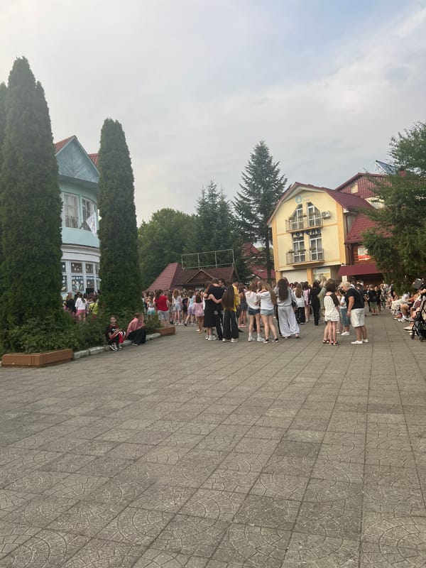 Outdoor gathering with dancing at a resort-style venue in Сонячне