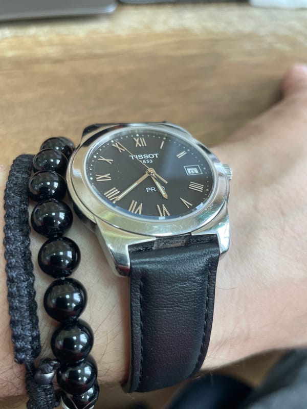 Flowers, a watch, and a laptop keyboard in Moscow