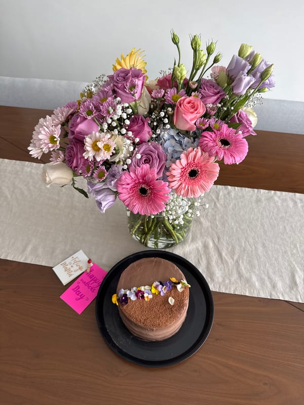 Woman photographs floral table arrangement in Puebla home