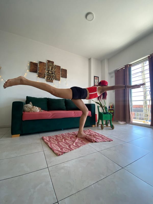 Woman conducts home yoga session with dog in Argentina